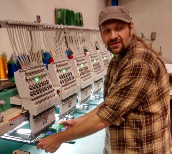 Erich Campbell at the embroidery machine